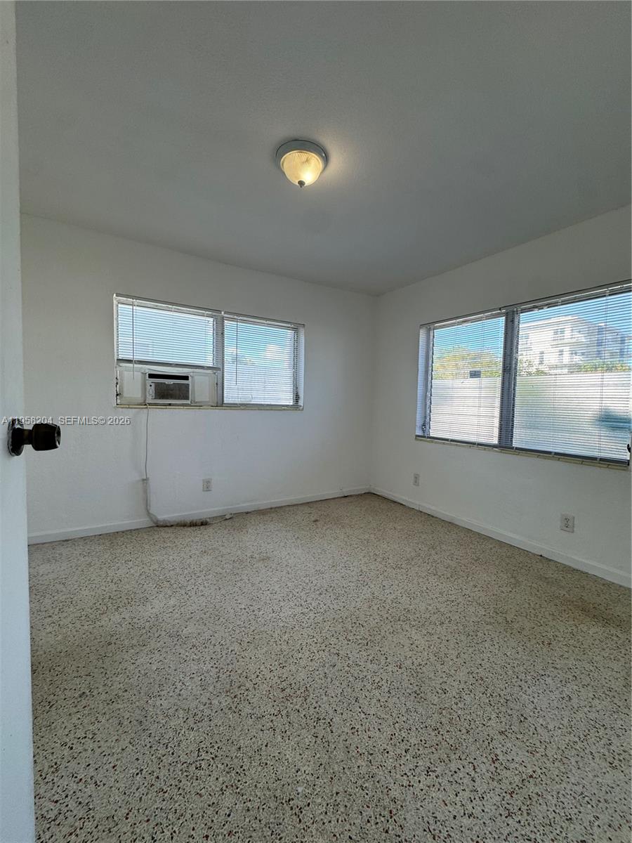 770 83rd Street Miami Beach, FL 33141 - Photo 11 of 14 a view of an empty room with a window