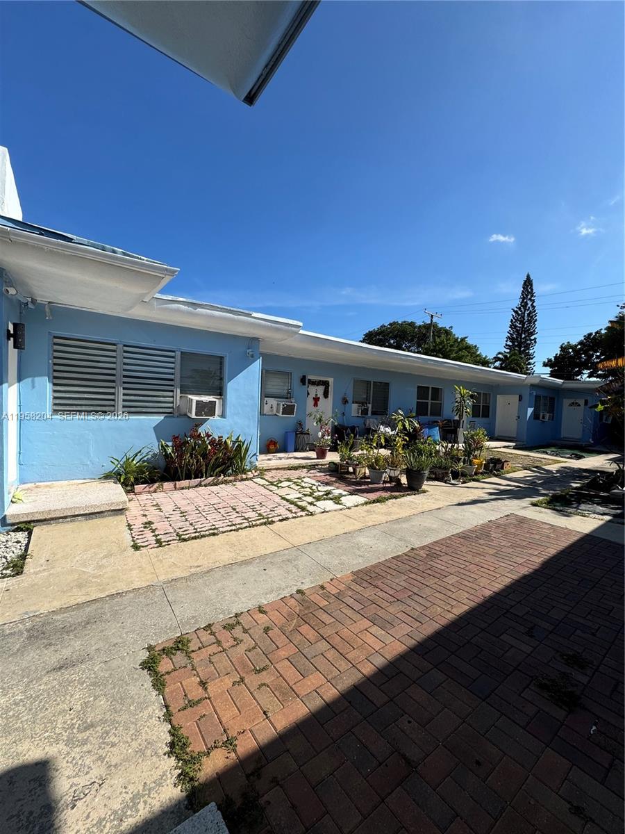 770 83rd Street Miami Beach, FL 33141 - Photo 6 of 14 a swimming pool view with a outdoor seating