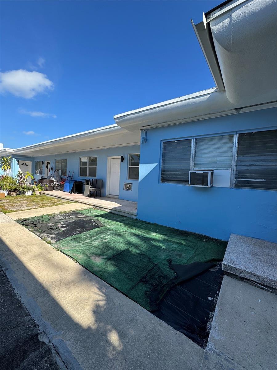 770 83rd Street Miami Beach, FL 33141 - Photo 8 of 14 a view of a patio with table and chairs and a barbeque