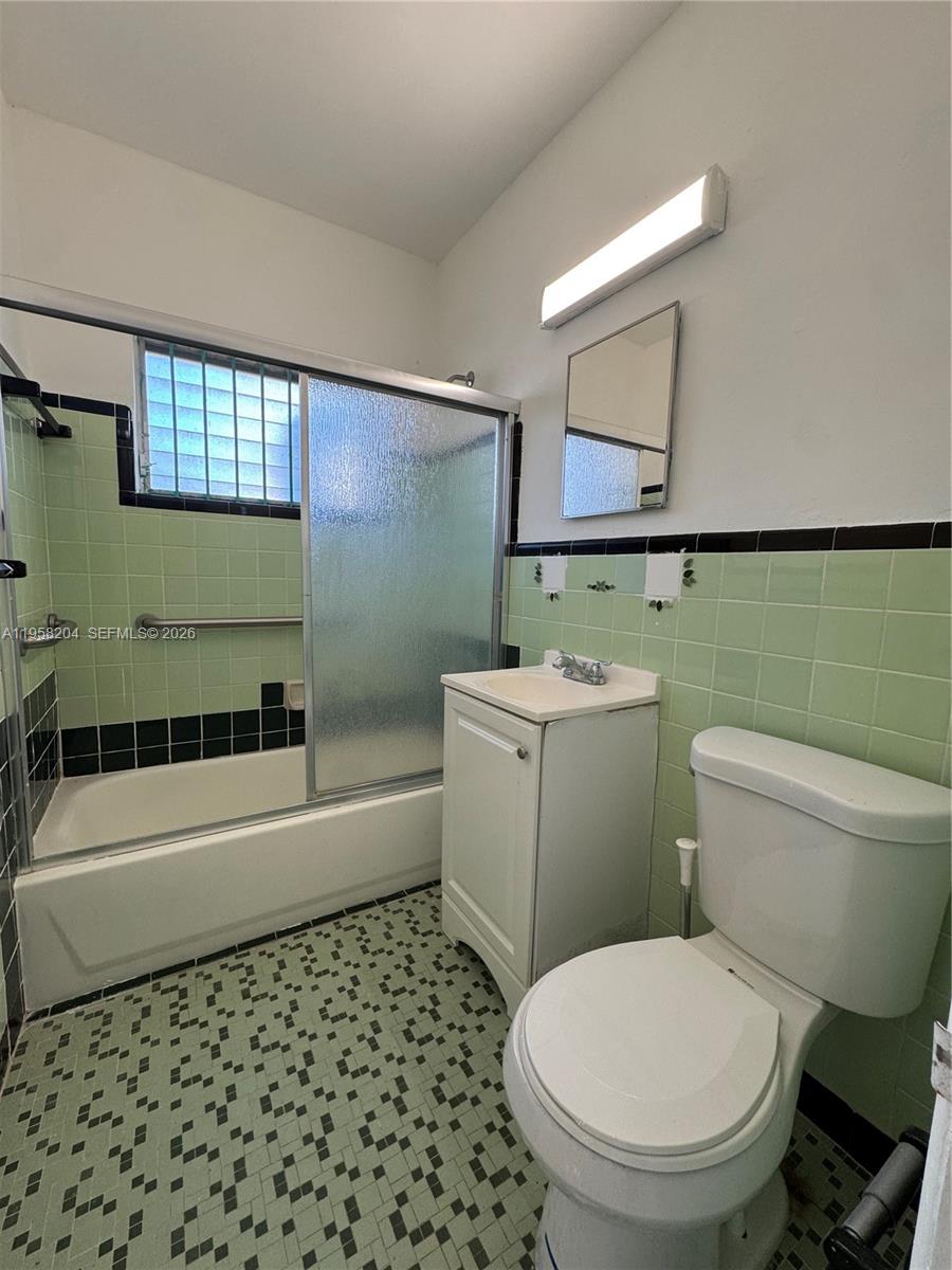 770 83rd Street Miami Beach, FL 33141 - Photo 9 of 14 a bathroom with a sink toilet and shower