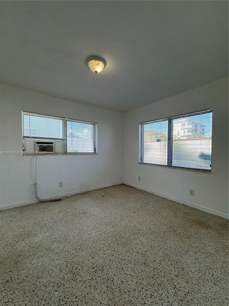 770 83rd Street Miami Beach, FL 33141 - Photo 10 of 14 an empty room with windows