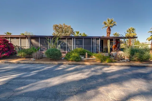 a view of a house with a street