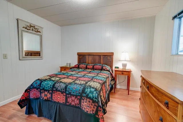 a bedroom with a bed and a dresser