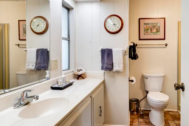 a bathroom with a toilet and a sink