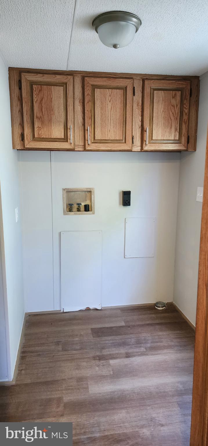 2894 Byrdtown Road Crisfield, MD 21817 - Photo 19 of 24 Bright, airy space with wooden cabinetry.