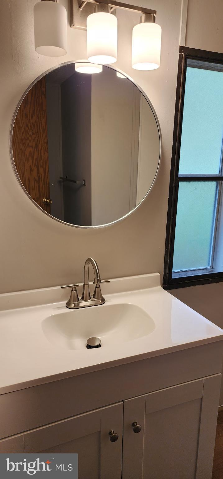 2894 Byrdtown Road Crisfield, MD 21817 - Photo 4 of 24 Sleek bathroom with modern elegance.