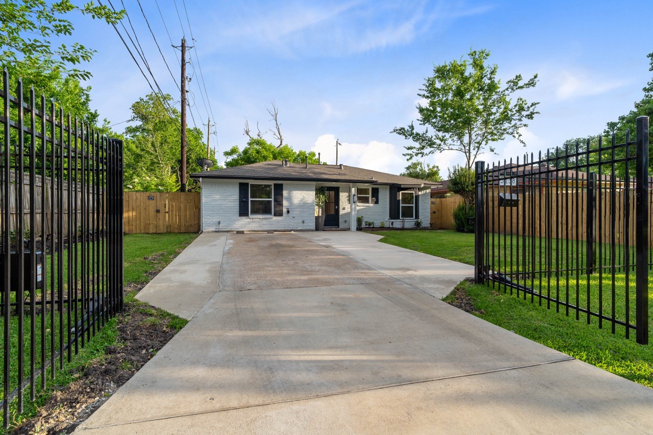 3138 Sunbeam Street Houston, TX 77051 - Photo 4 of 50 Welcome home to a private gated sanctuary with wide-open parking, lush green space, and a beautifully updated exterior designed to impress day or night.