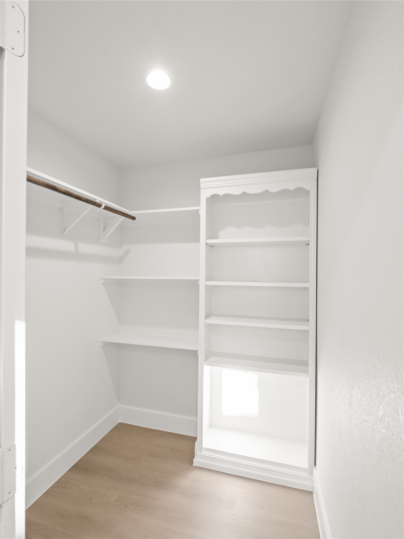 218 Crystal Knoll Boulevard Georgetown, TX 78626 - Photo 17 of 27 Walk in closet featuring light wood finished floors