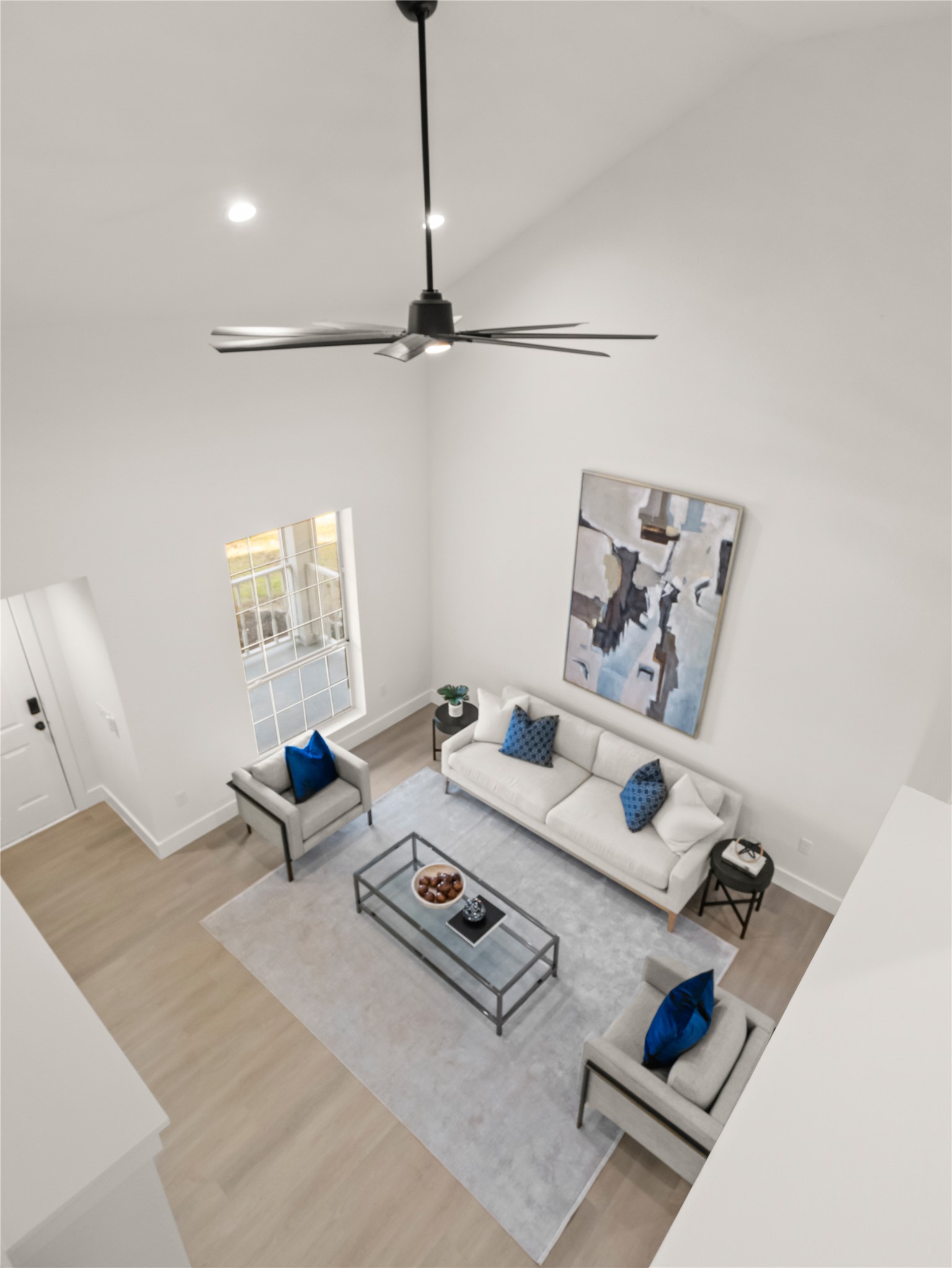 218 Crystal Knoll Boulevard Georgetown, TX 78626 - Photo 19 of 27 Living area featuring wood finished floors, high vaulted ceiling, a ceiling fan, and recessed lighting