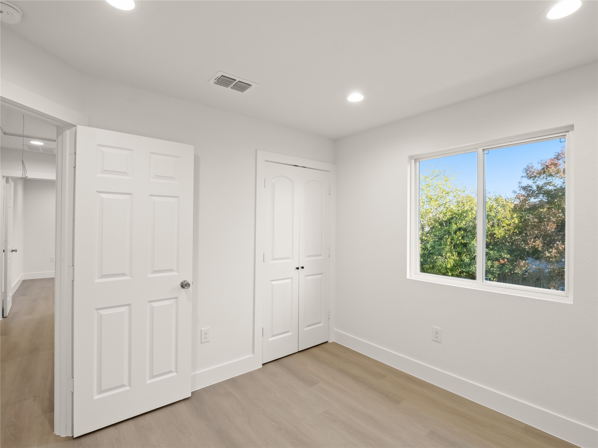 218 Crystal Knoll Boulevard Georgetown, TX 78626 - Photo 22 of 27 Unfurnished bedroom with light wood-style flooring, recessed lighting, and a closet