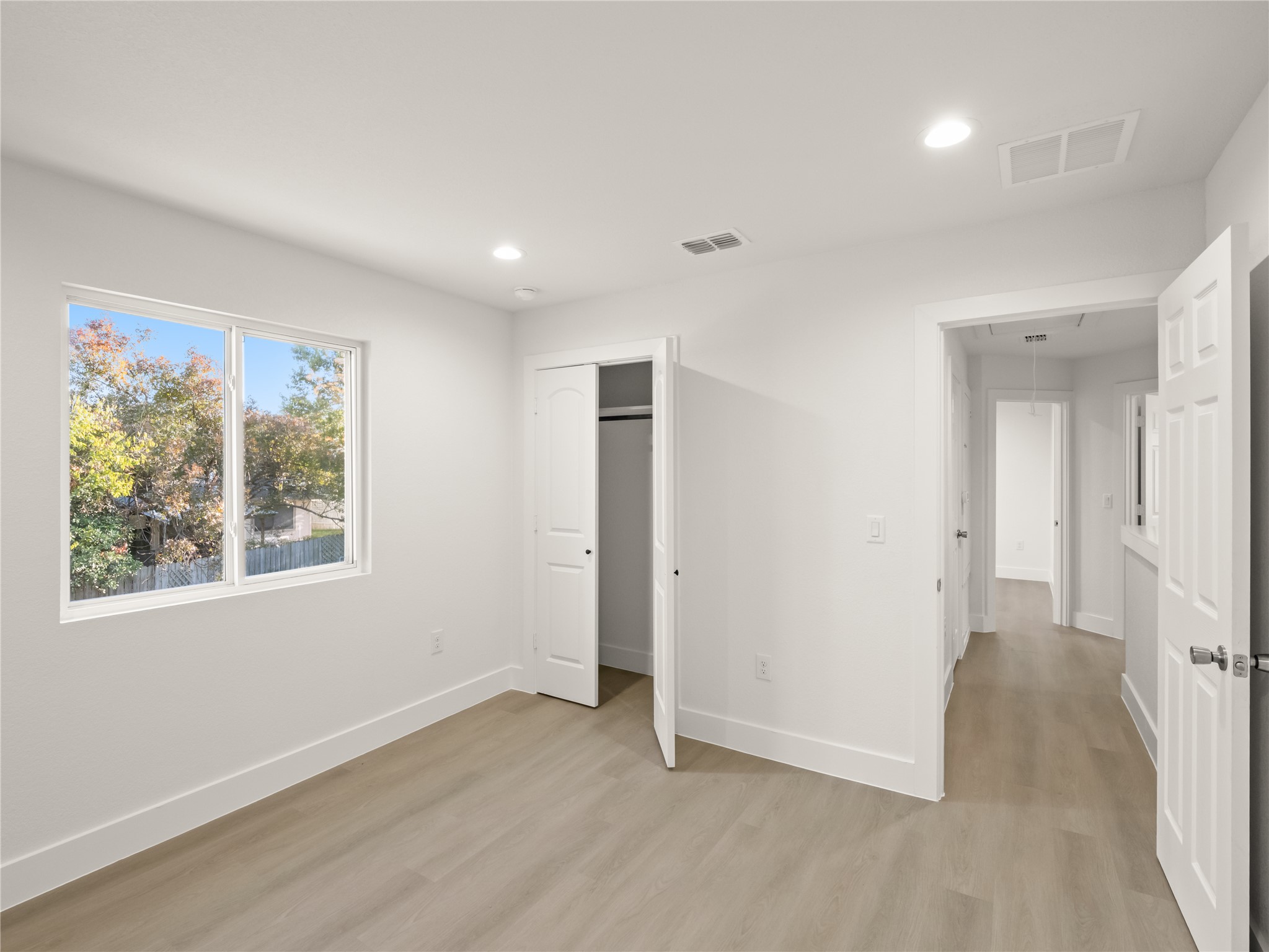 218 Crystal Knoll Boulevard Georgetown, TX 78626 - Photo 23 of 27 Unfurnished bedroom featuring light wood-style floors, recessed lighting, and a closet