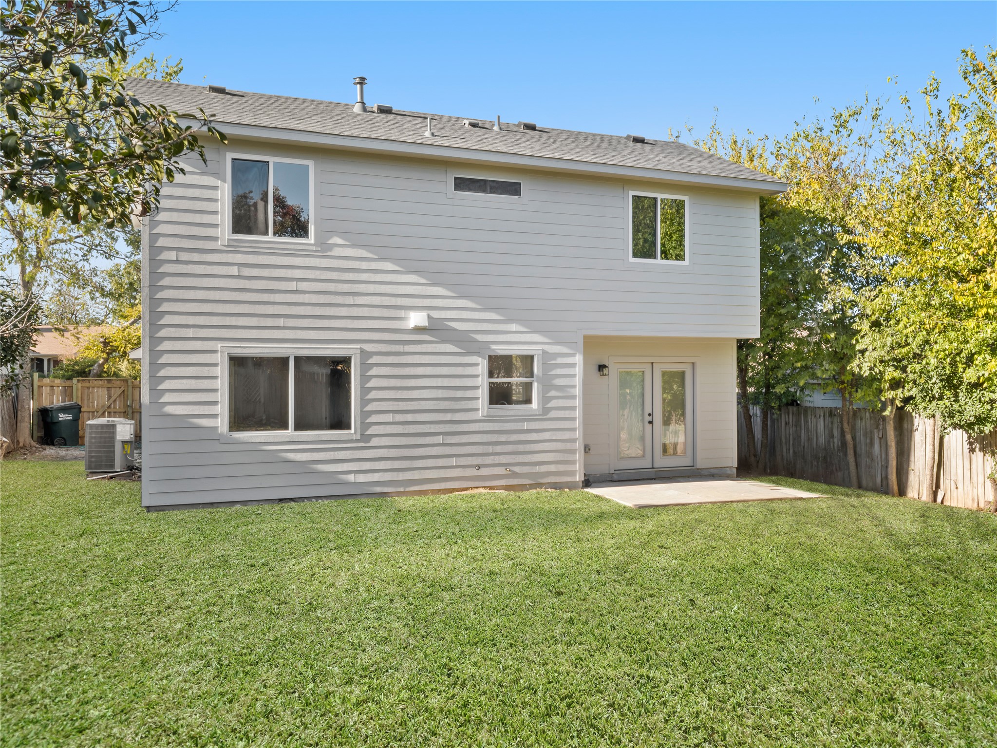 218 Crystal Knoll Boulevard Georgetown, TX 78626 - Photo 24 of 27 Rear view of house featuring a fenced backyard, a patio area, and french doors