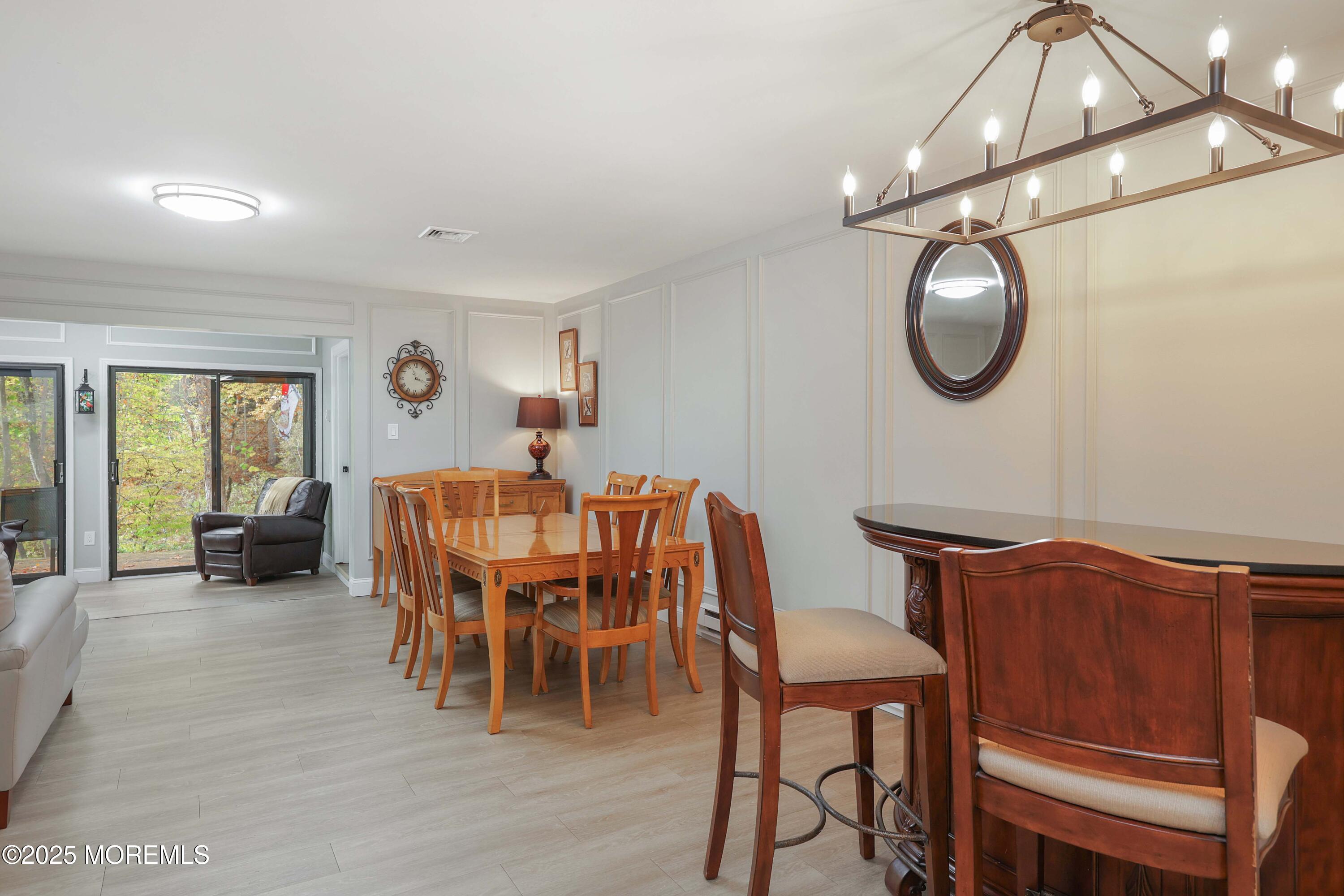 40 Ellsworth Court Red Bank, NJ 07701 - Photo 12 of 30 a view of a dining room with furniture and chandelier