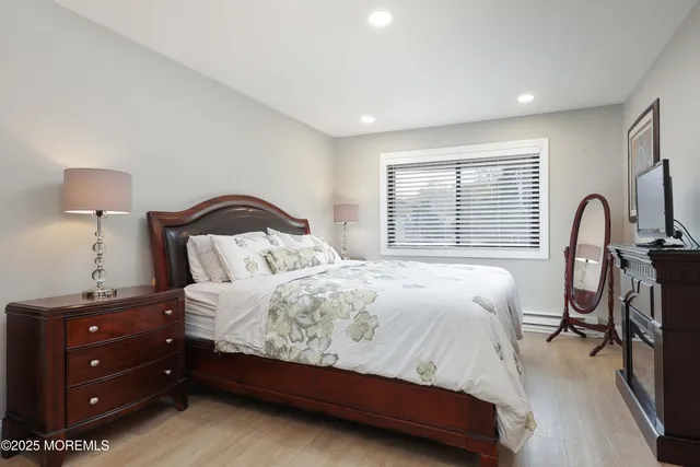 a bedroom with a bed and a lamp