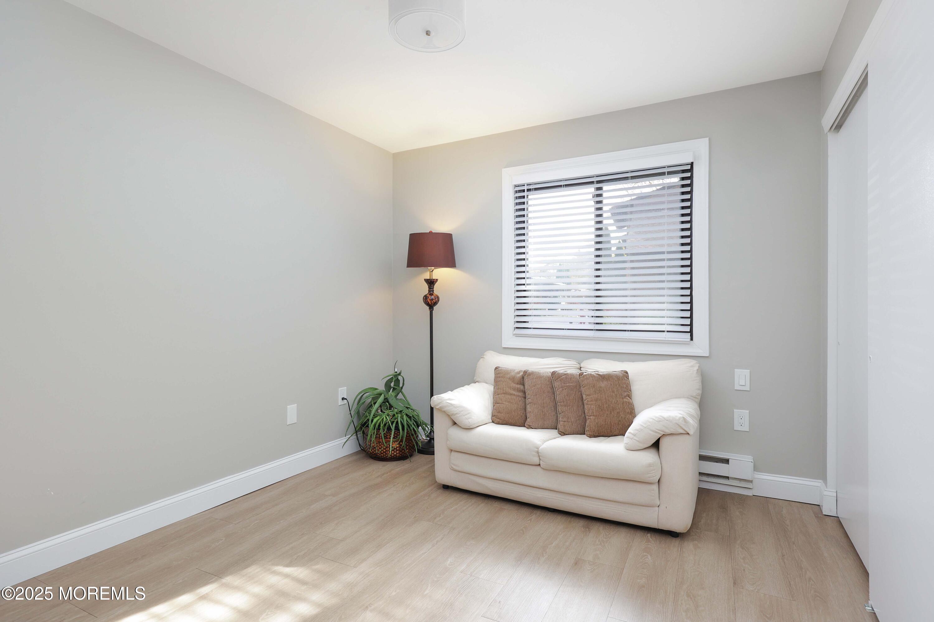 40 Ellsworth Court Red Bank, NJ 07701 - Photo 18 of 30 a living room with furniture and a window