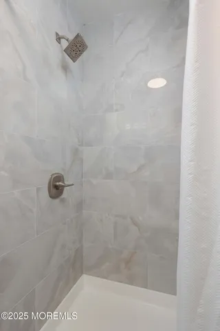 a close view of a shower in bathroom