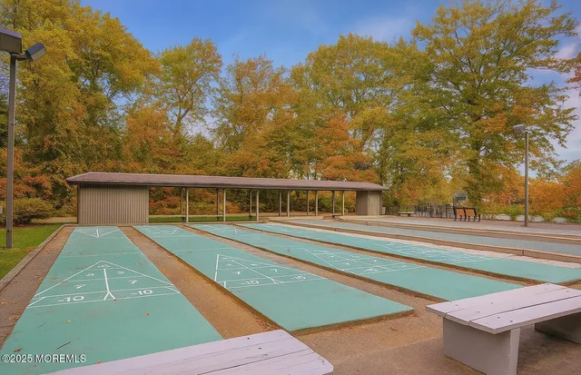 a view of lawn chairs and umbrella