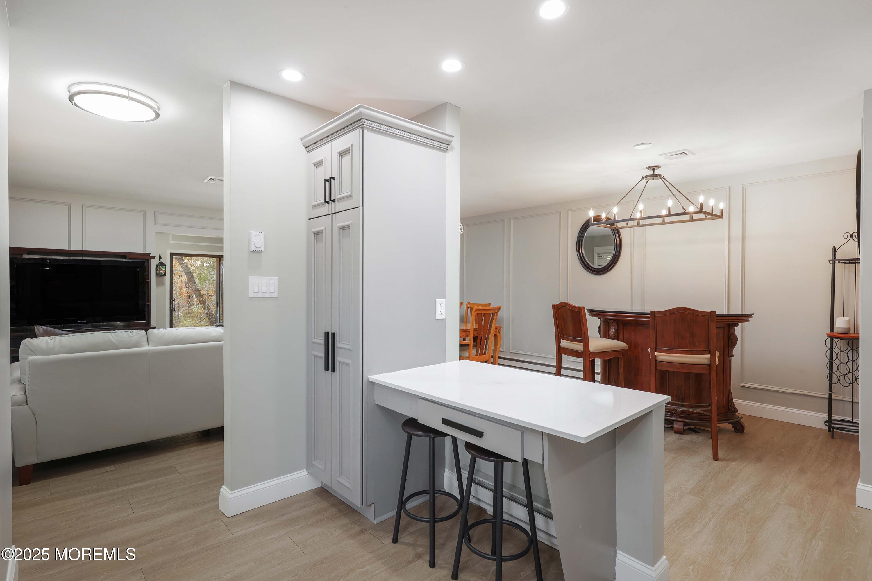 40 Ellsworth Court Red Bank, NJ 07701 - Photo 7 of 30 a view of a dining area with furniture and a flat screen tv