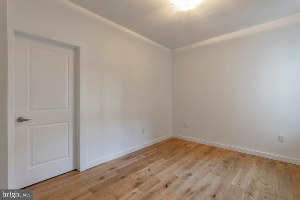 224 Church Street, Unit 406 Philadelphia, PA 19106 - Photo 4 of 14 a view of empty room with wooden floor