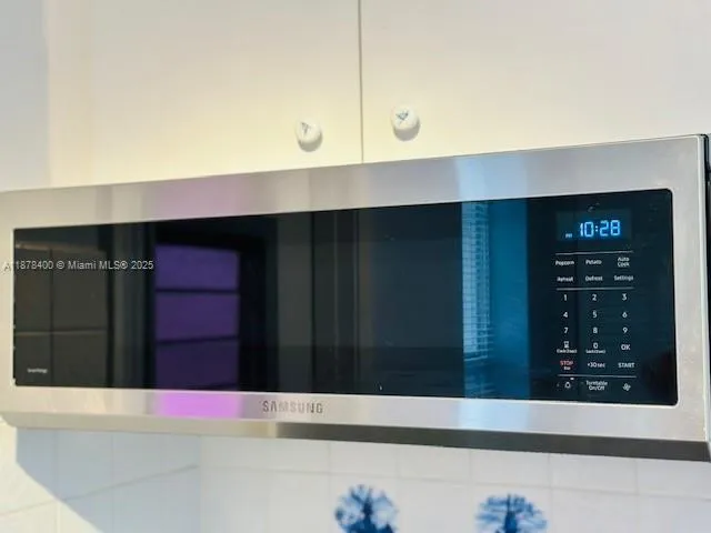 a room with wooden floor and fireplace