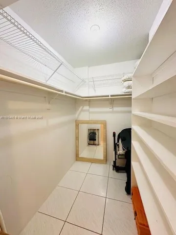 a view of a chair and tables in balcony