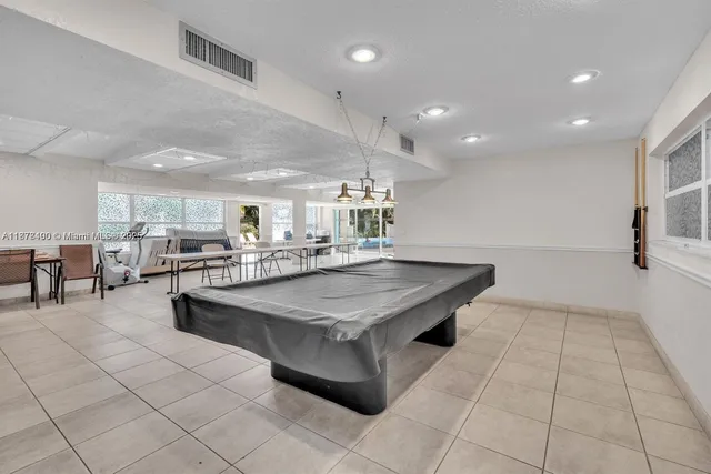 a bathroom with a glass shower door and a sink