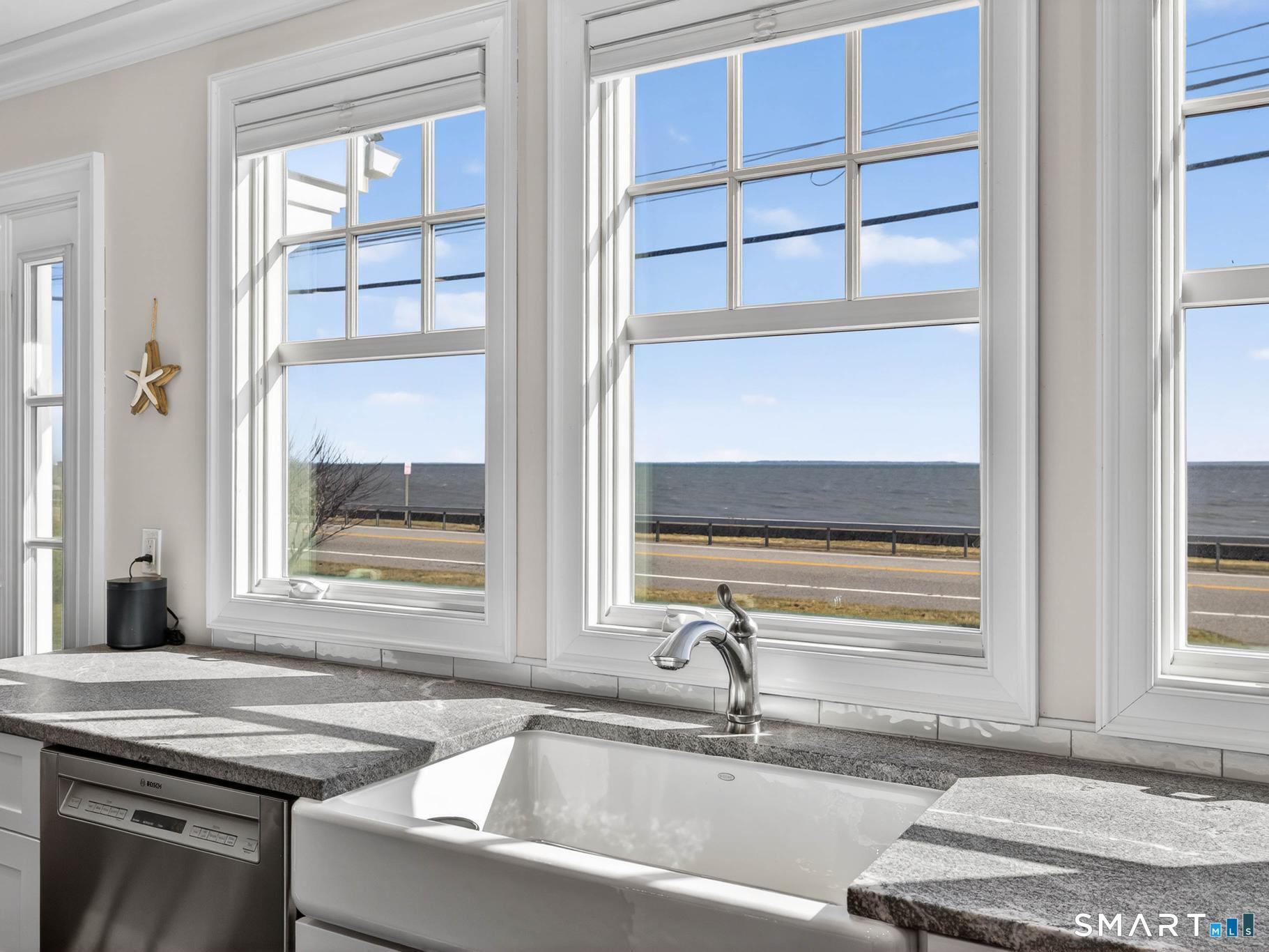 382 Maple Avenue Old Saybrook, CT 06475 - Photo 12 of 42 a bathroom with a granite countertop sink and a window