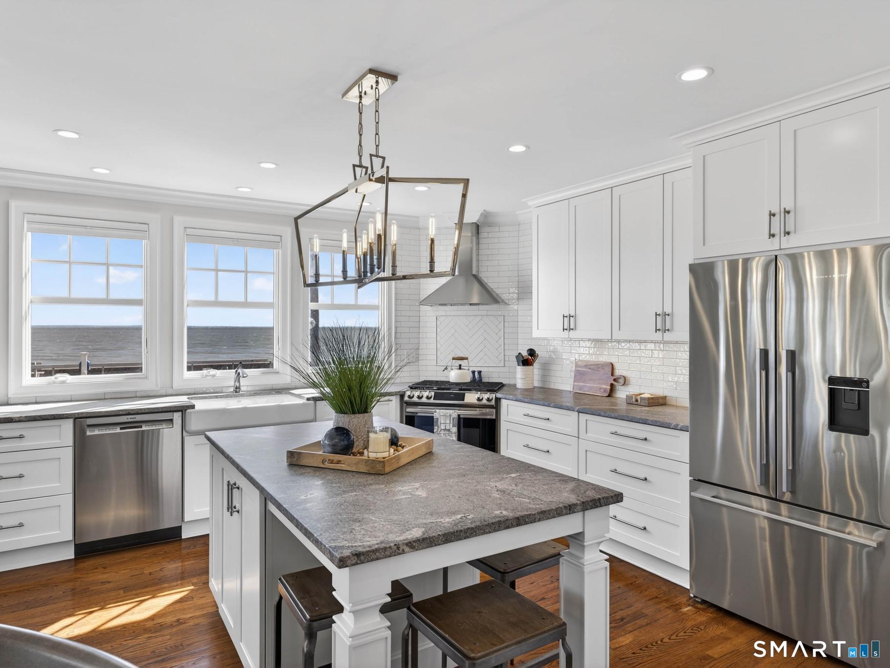 382 Maple Avenue Old Saybrook, CT 06475 - Photo 14 of 42 a kitchen with a center island appliances and cabinets