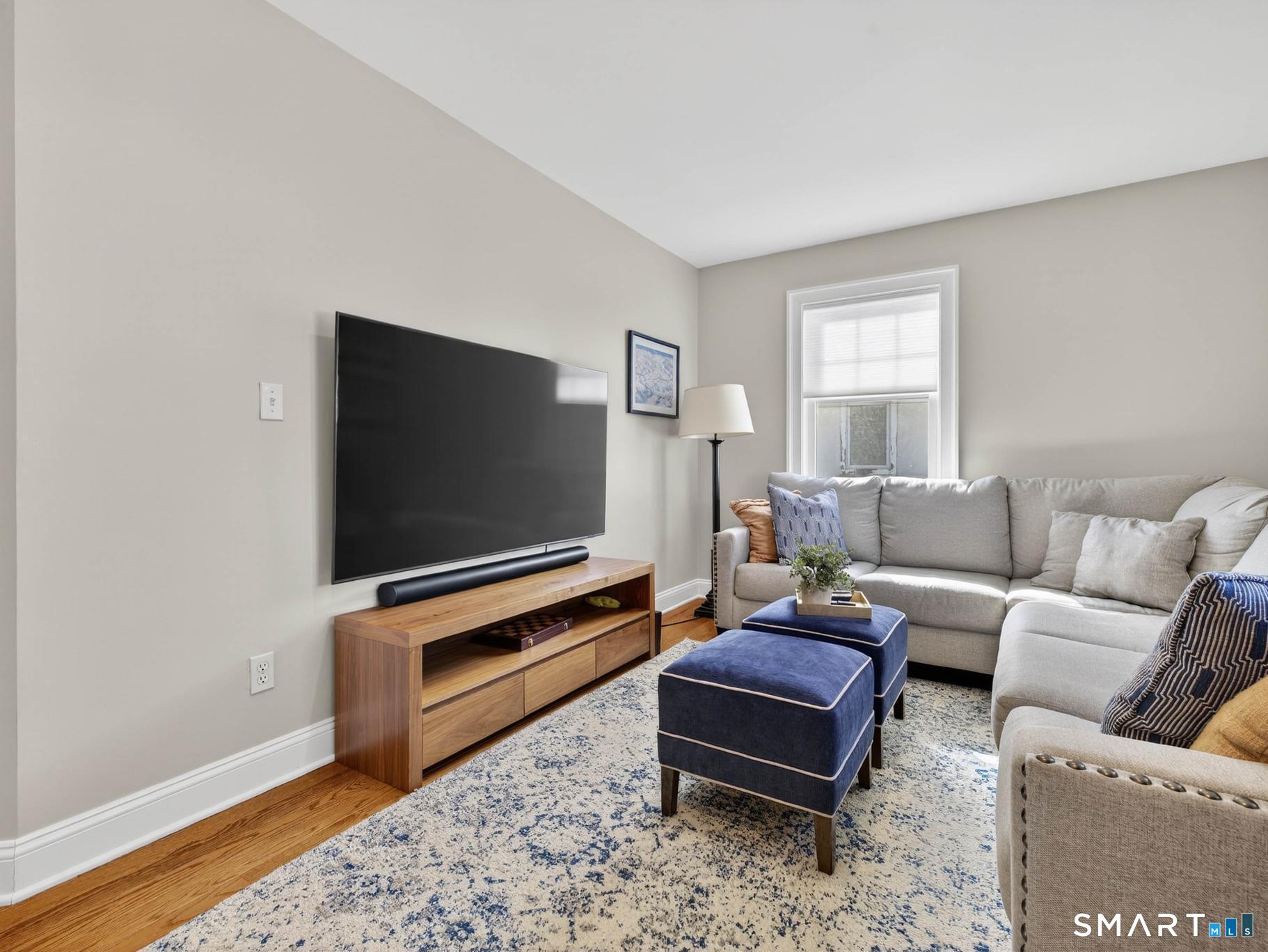 382 Maple Avenue Old Saybrook, CT 06475 - Photo 21 of 42 a living room with furniture and a flat screen tv