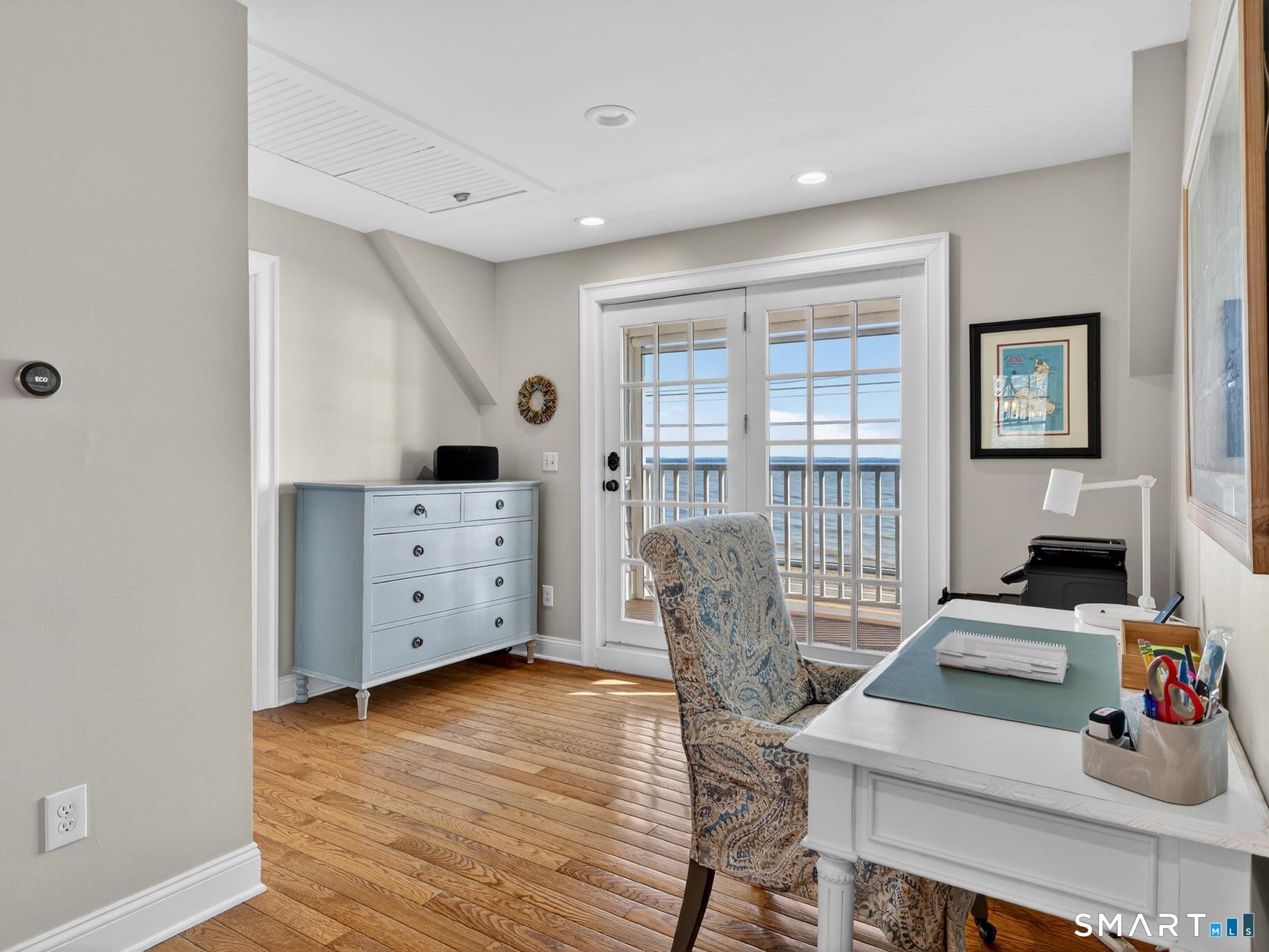 382 Maple Avenue Old Saybrook, CT 06475 - Photo 23 of 42 a living room with furniture and wooden floor