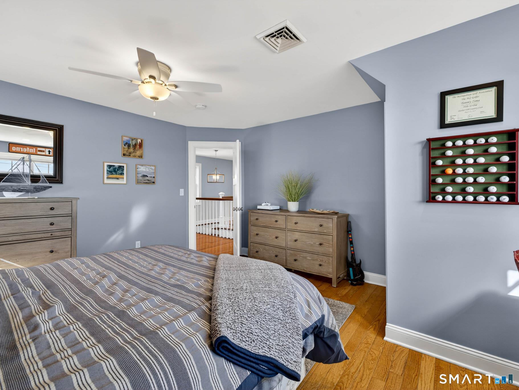 382 Maple Avenue Old Saybrook, CT 06475 - Photo 25 of 42 a bedroom with a bed and dresser