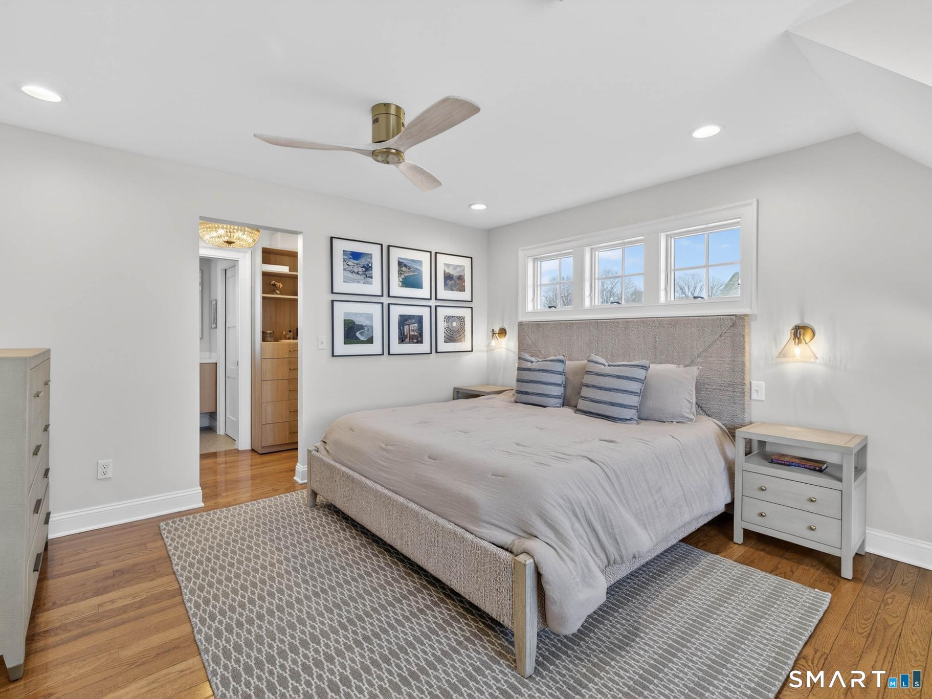 382 Maple Avenue Old Saybrook, CT 06475 - Photo 29 of 42 a bedroom with a large bed and a window
