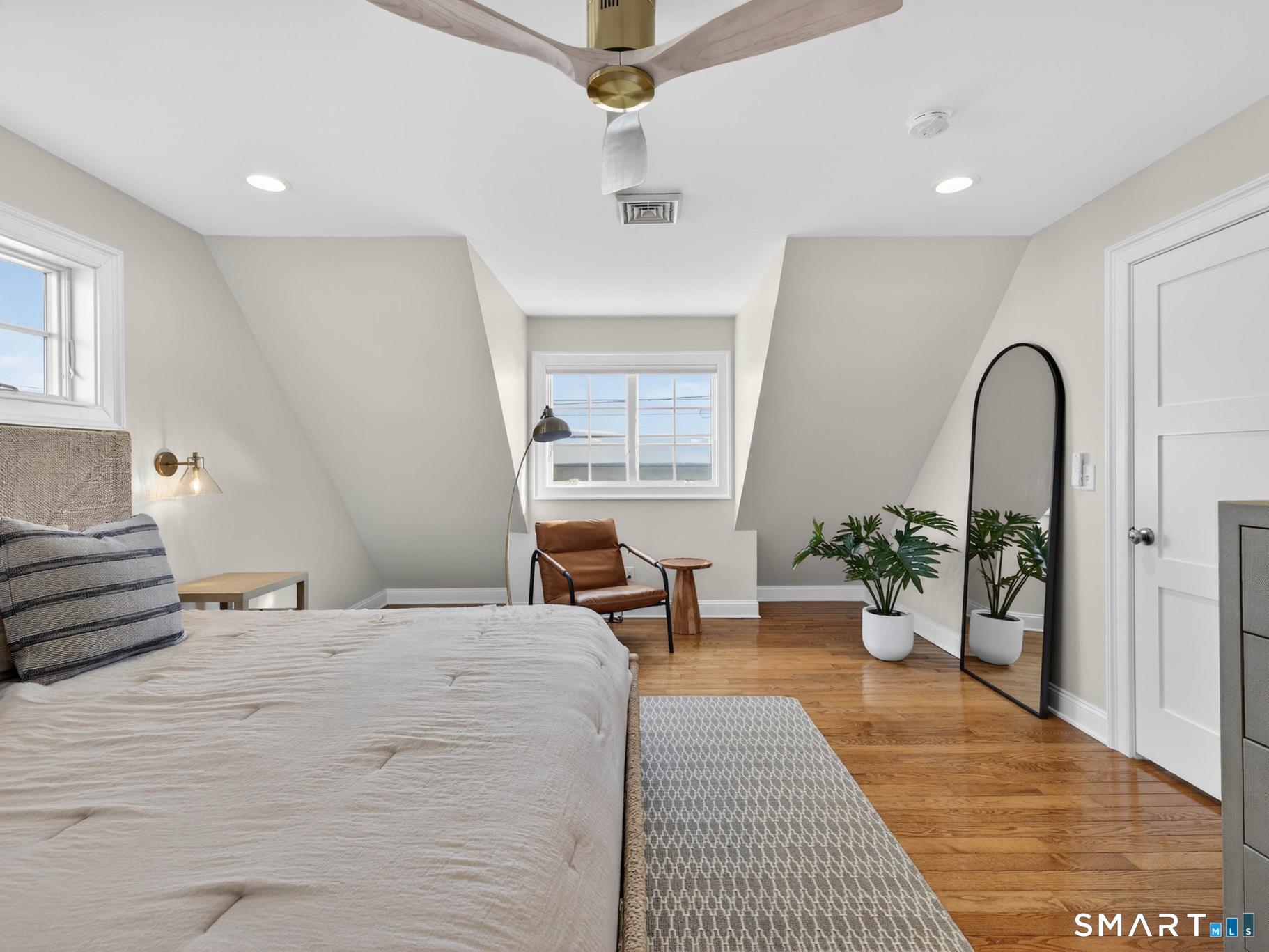 382 Maple Avenue Old Saybrook, CT 06475 - Photo 30 of 42 a bedroom with a large bed and windows