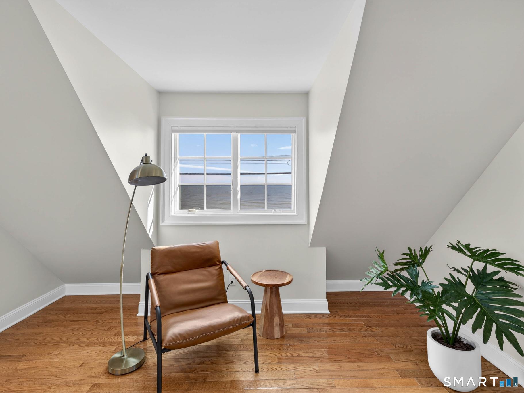 382 Maple Avenue Old Saybrook, CT 06475 - Photo 32 of 42 a view of a livingroom with a potted plant