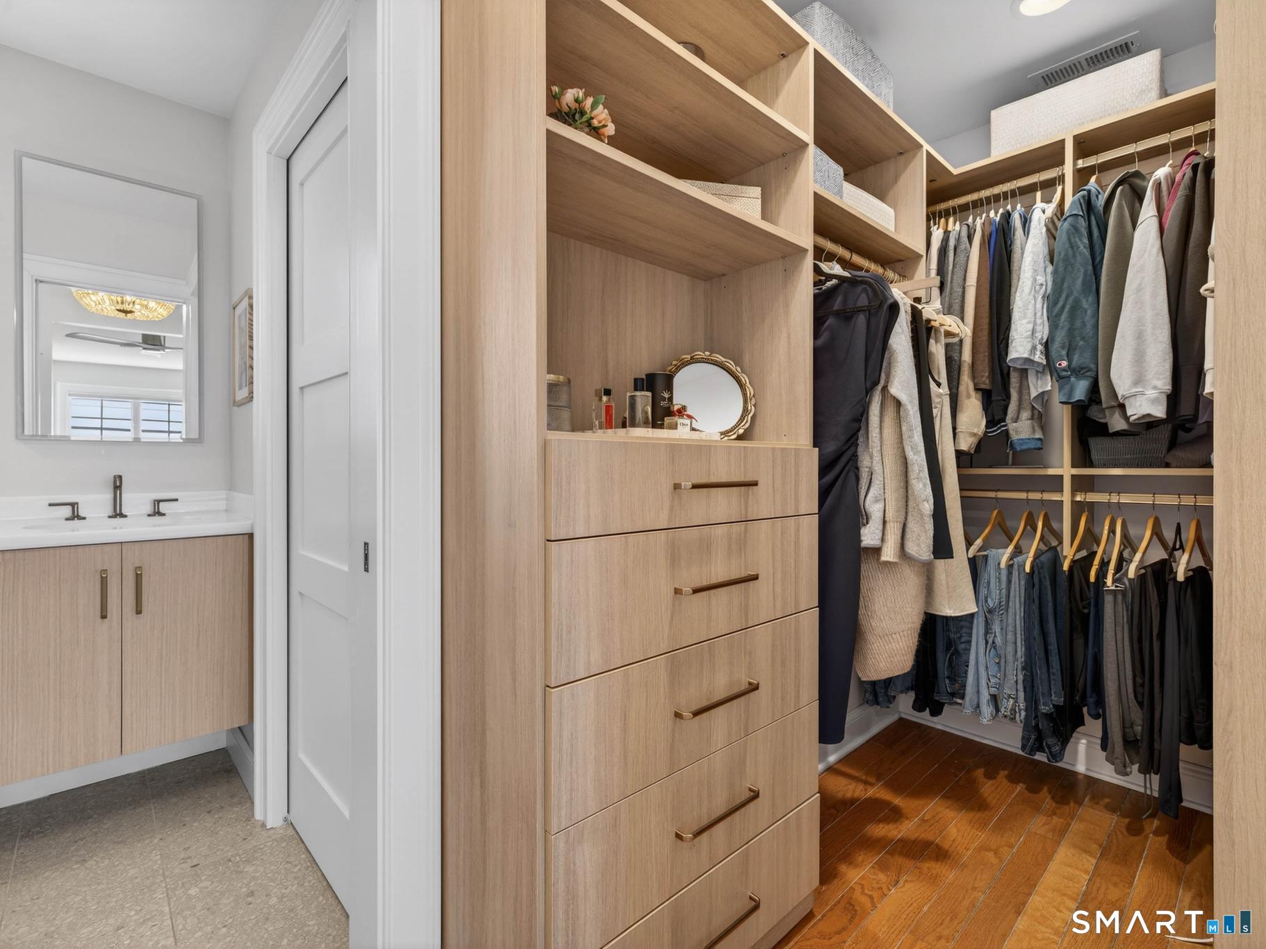 382 Maple Avenue Old Saybrook, CT 06475 - Photo 33 of 42 a view of walk in closet with clothes and shoes
