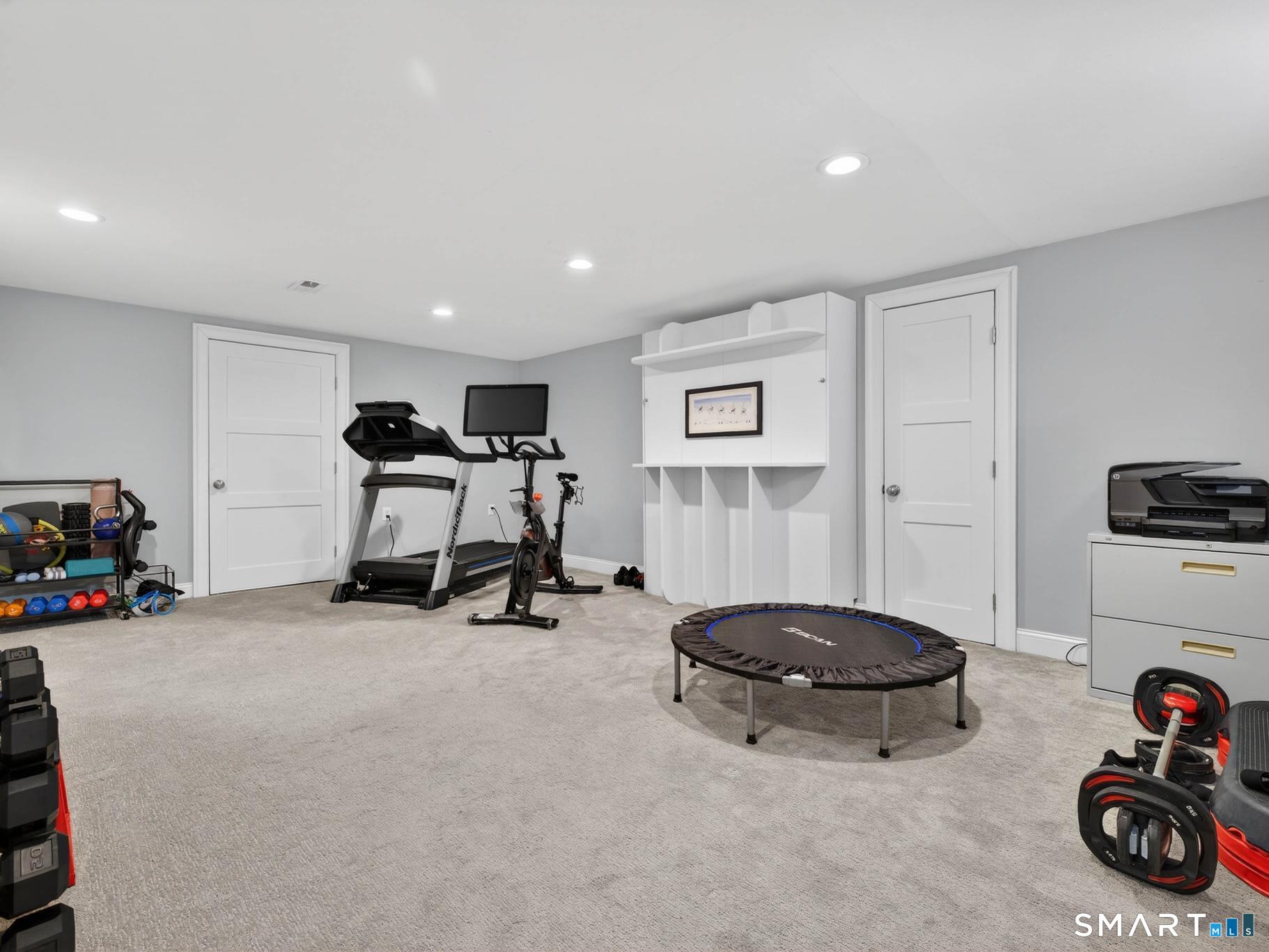 382 Maple Avenue Old Saybrook, CT 06475 - Photo 36 of 42 a view of a room with gym equipment and a window