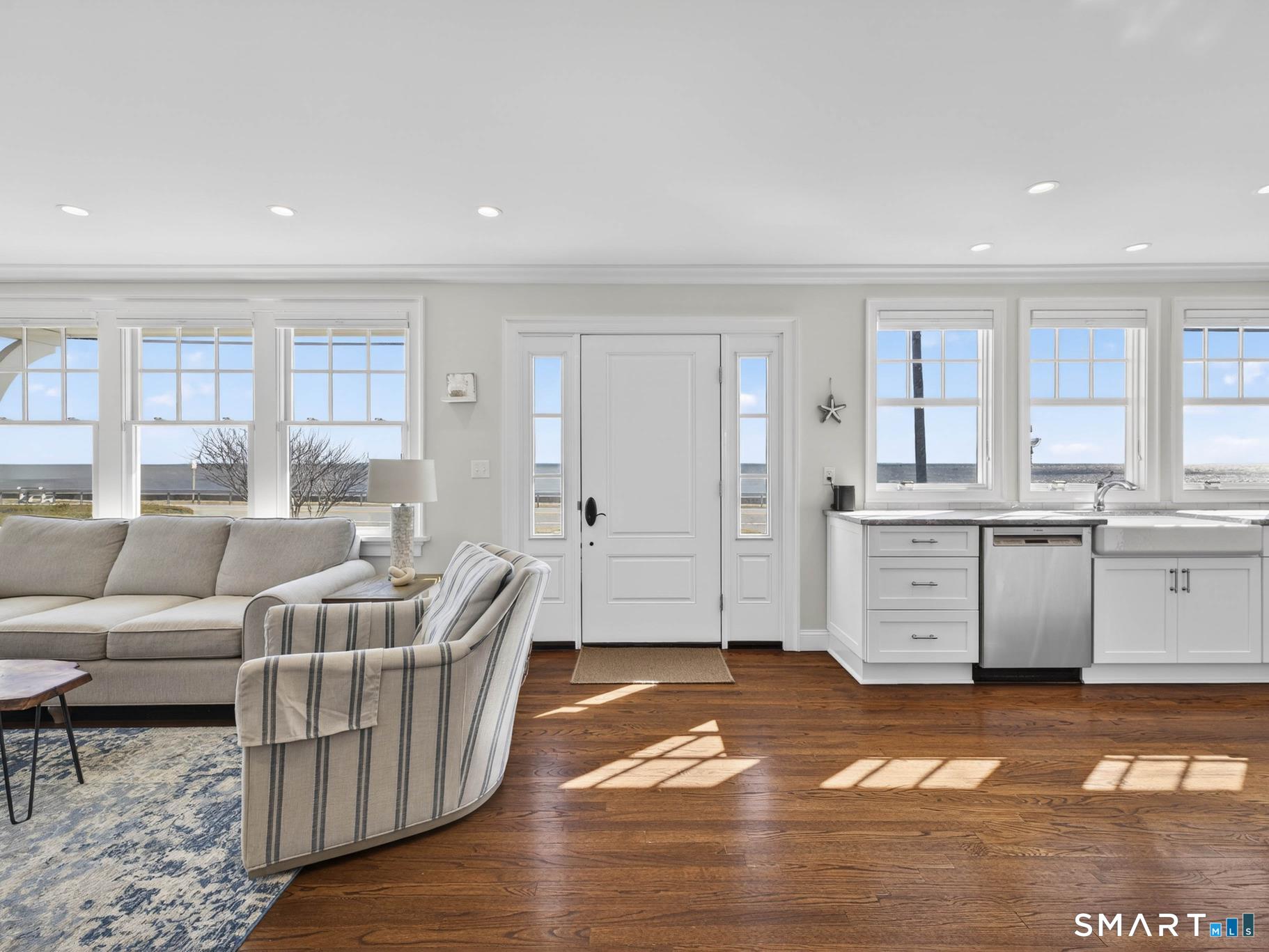 382 Maple Avenue Old Saybrook, CT 06475 - Photo 4 of 42 a living room with furniture cabinets and a kitchen