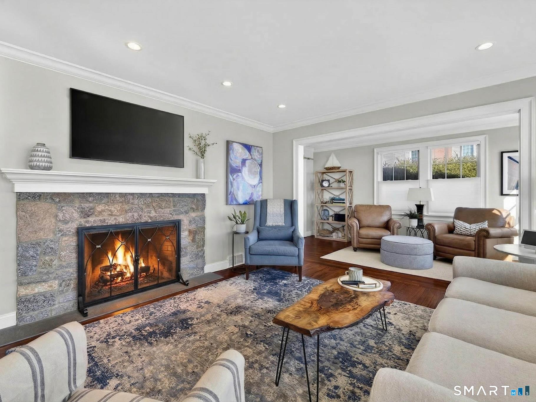 382 Maple Avenue Old Saybrook, CT 06475 - Photo 6 of 42 a living room with furniture fireplace and flat screen tv