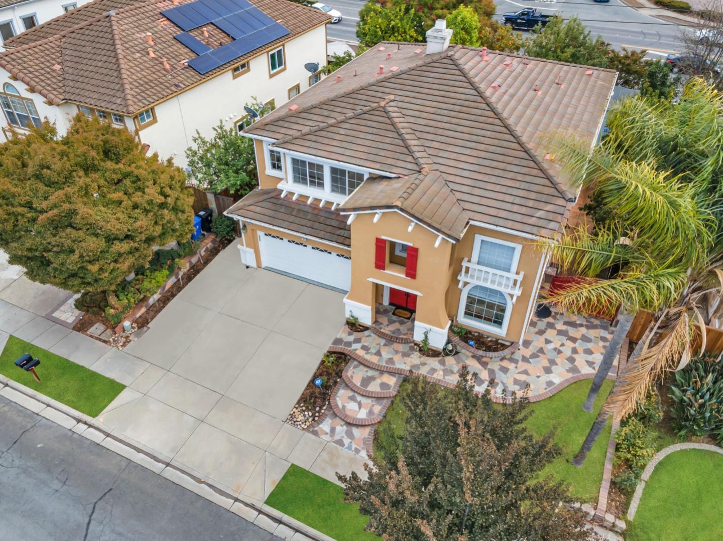 a front view of a house with garden