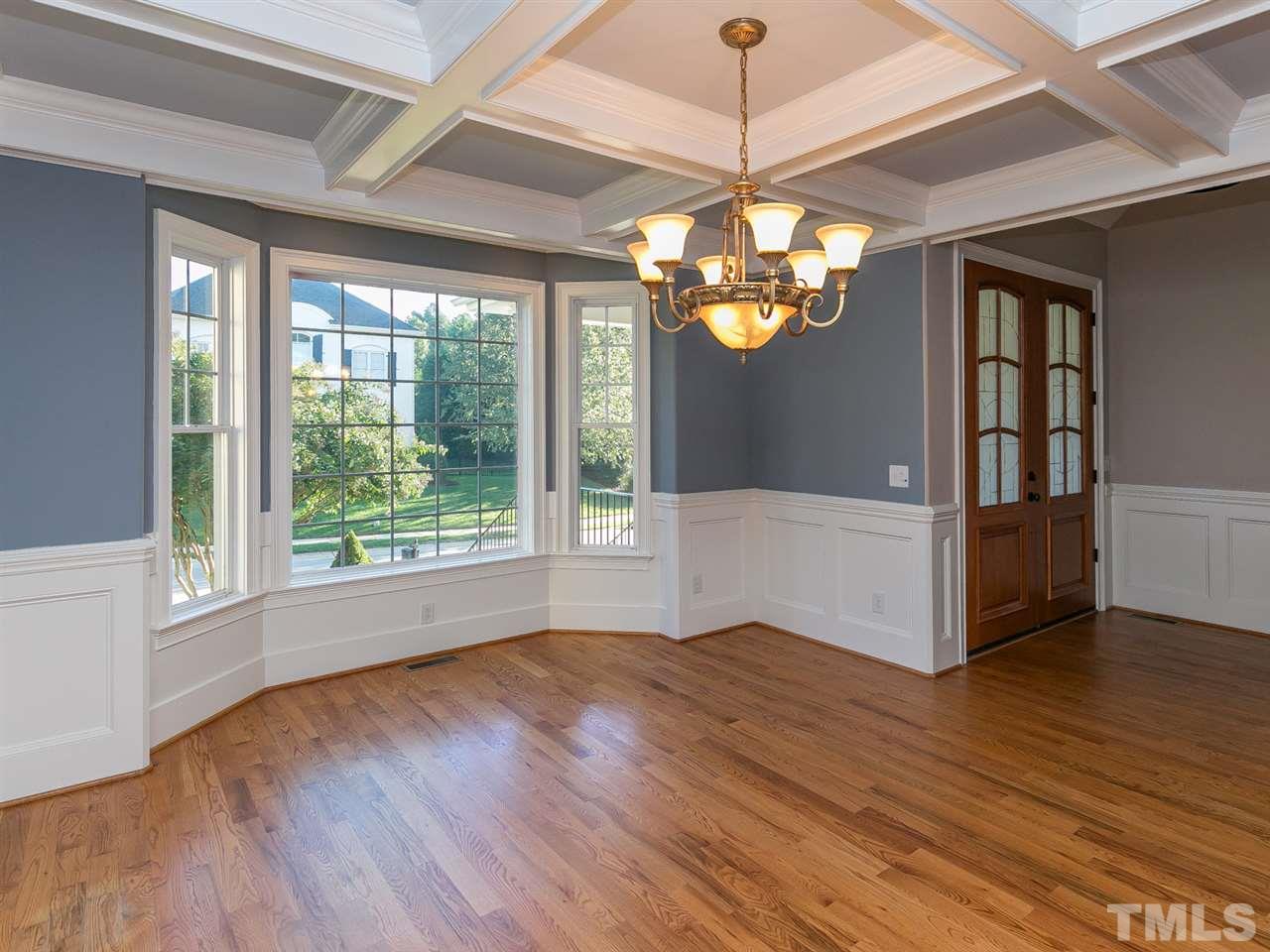12225 Beestone Lane Raleigh, NC 27614 - Photo 2 of 25 a view of livingroom with window wooden floor and chandelier