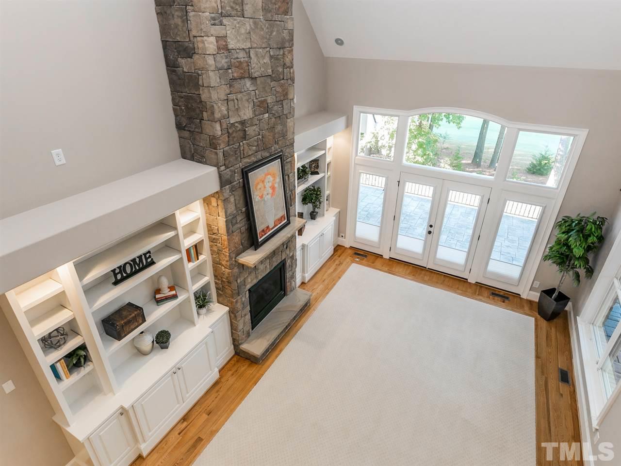 12225 Beestone Lane Raleigh, NC 27614 - Photo 12 of 25 wooden floor in an empty room with a fireplace