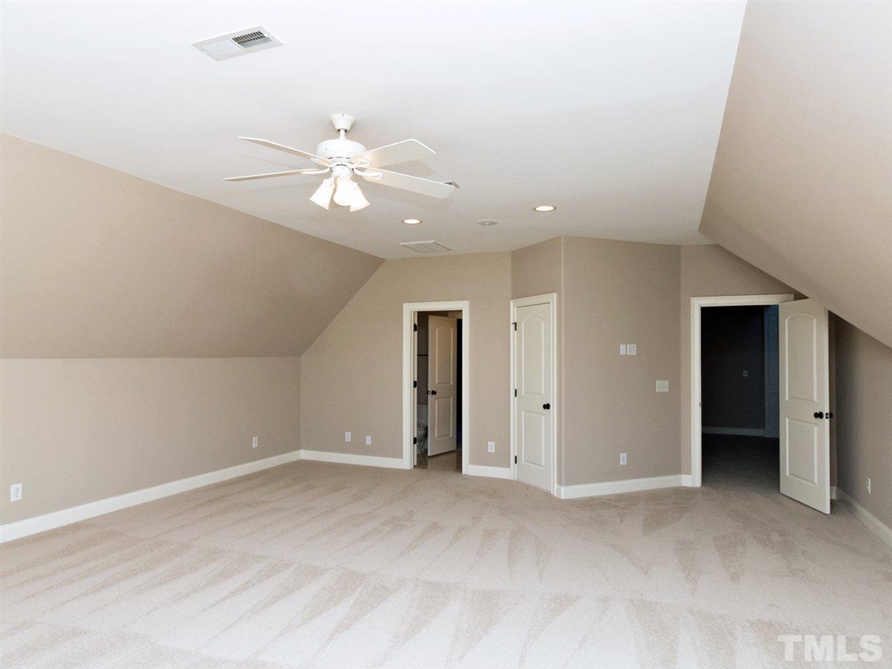 12225 Beestone Lane Raleigh, NC 27614 - Photo 14 of 25 an empty room with closet and a ceiling fan