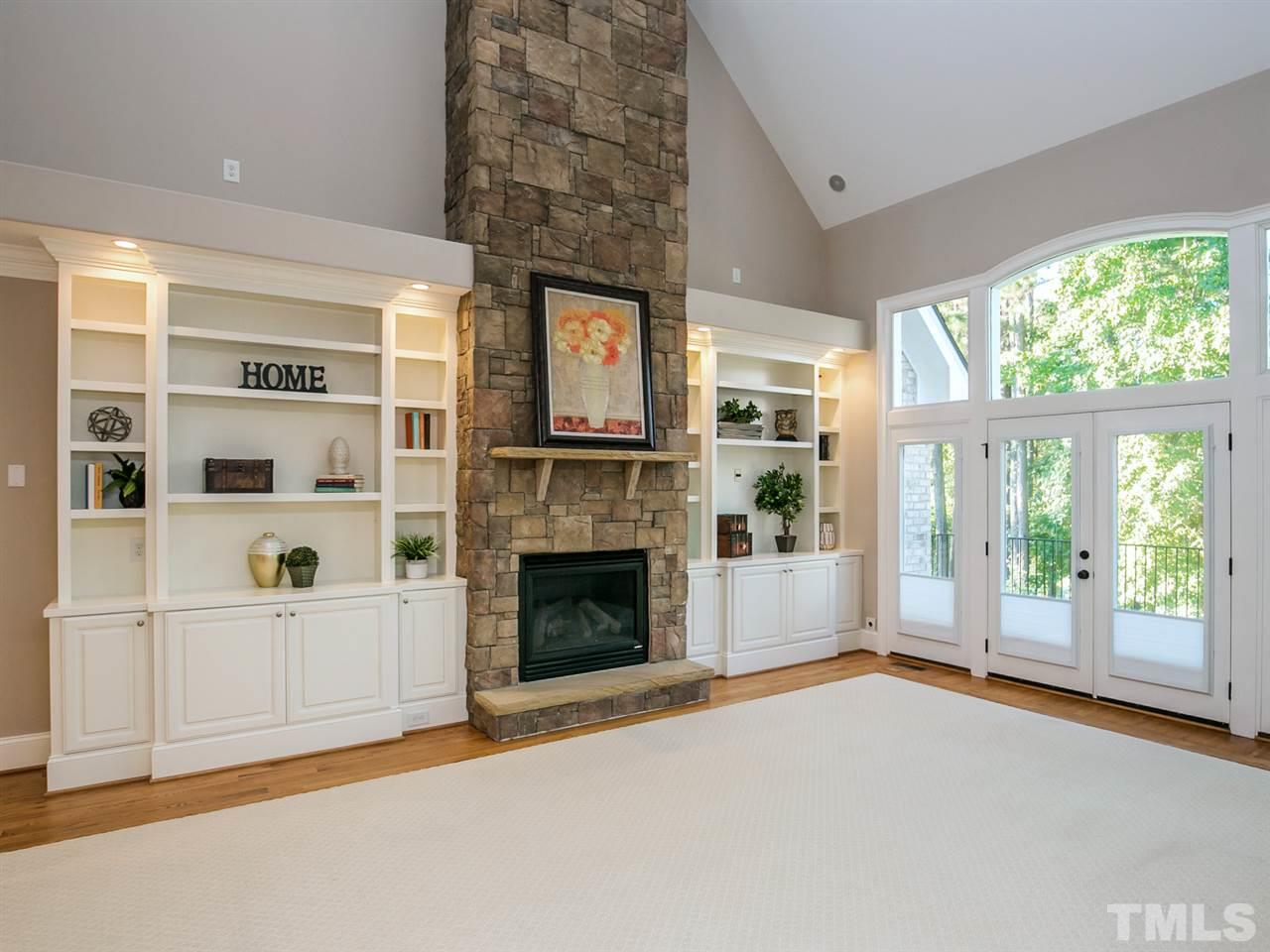12225 Beestone Lane Raleigh, NC 27614 - Photo 3 of 25 a living room with furniture and a fireplace