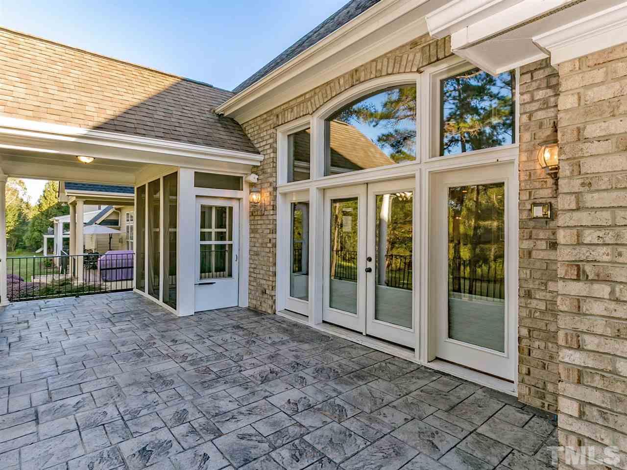 12225 Beestone Lane Raleigh, NC 27614 - Photo 21 of 25 a view of a brick house with a large window