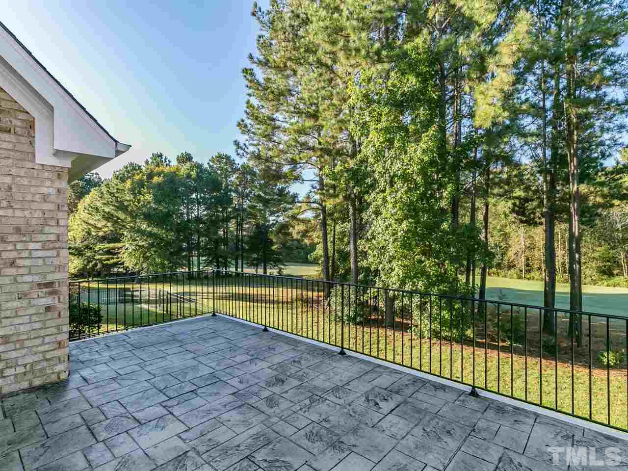 12225 Beestone Lane Raleigh, NC 27614 - Photo 25 of 25 a view of a backyard with a large tree