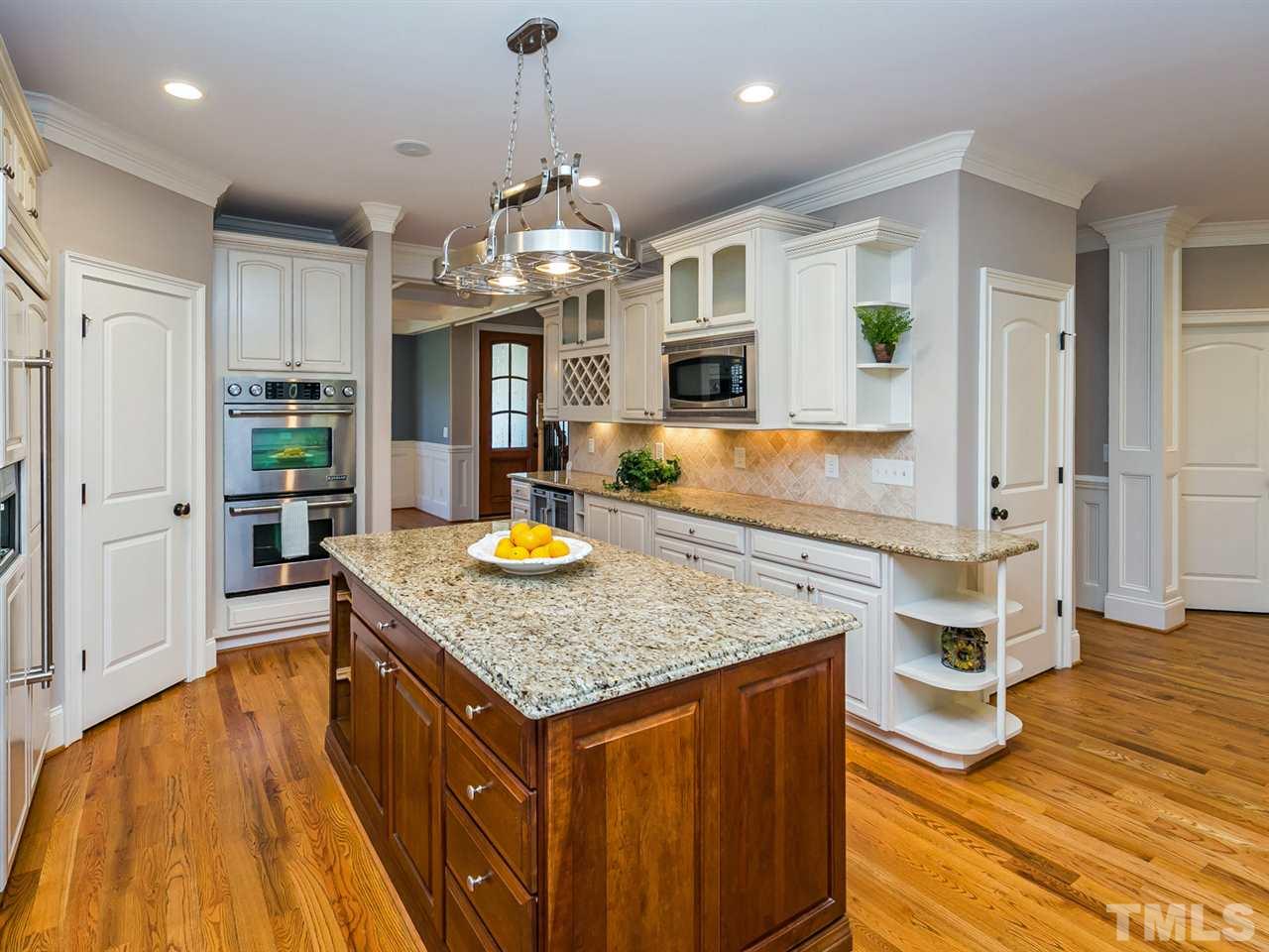 12225 Beestone Lane Raleigh, NC 27614 - Photo 6 of 25 a kitchen with stainless steel appliances granite countertop a stove and refrigerator