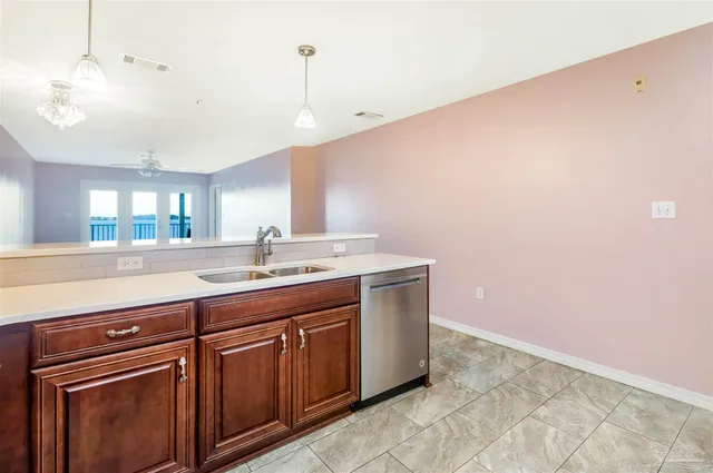 a kitchen with a stove and a refrigerator