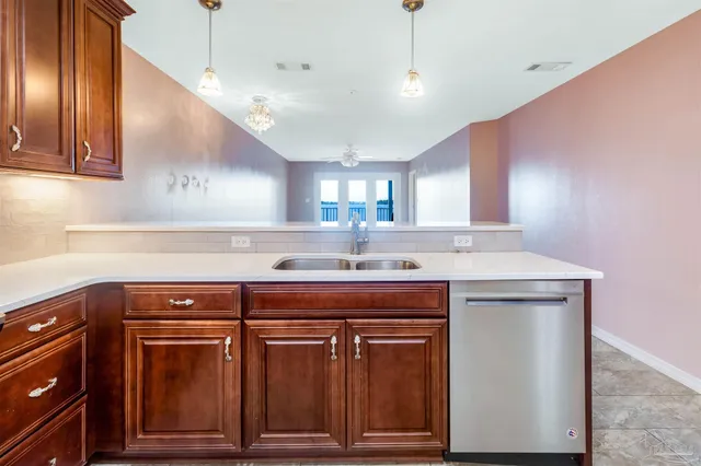 a view of a room with a ceiling fan