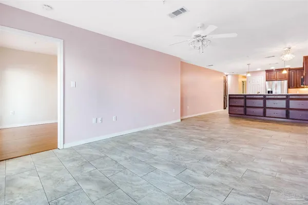 a view of a room with a ceiling fan