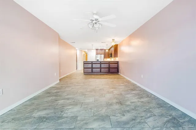 an empty room with windows and entrance